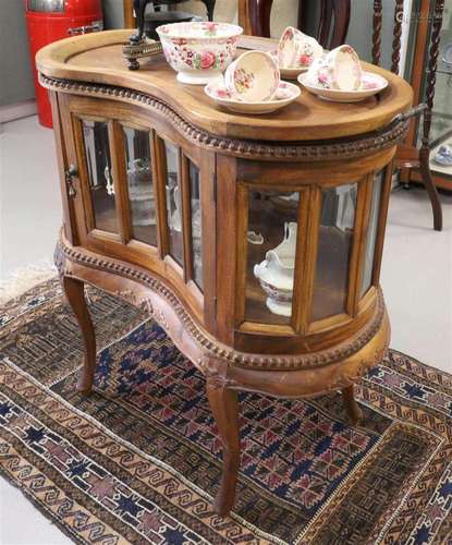 A mahogany kidney-shaped tea cabinet with cut glass, 20th ce...