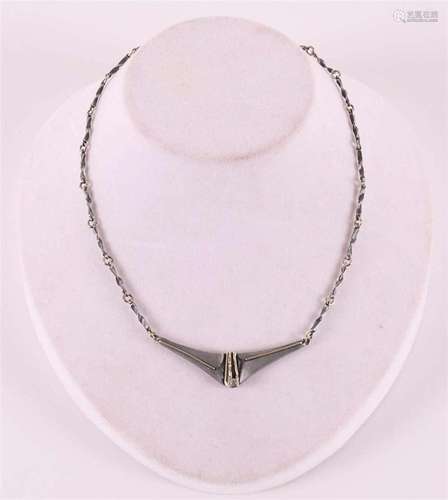 A first grade silver design necklace with intermediate piece...