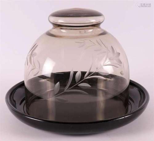 A fumi glass cheese dome on a black glass bottom dish, W.J.R...