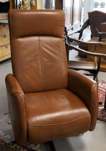 A brown leather recliner with electric control, Henders &...