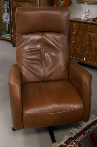 A brown leather recliner with electric control, Henders &...