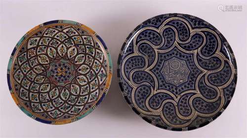 Three various polychromed earthenware Persian dishes, 20th c...