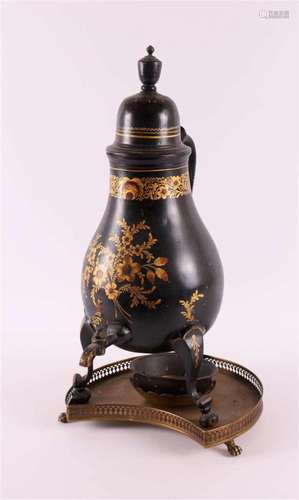 A black lacquered pear-shaped tap jug with gold-coloured flo...