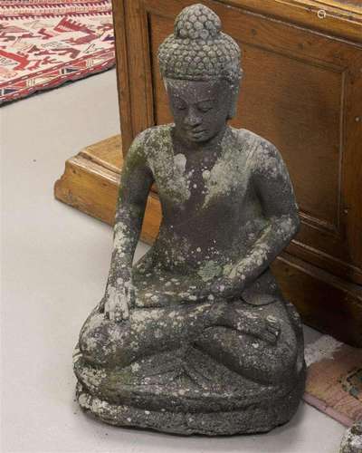 A concrete garden sculpture of a Buddha, 20th century.