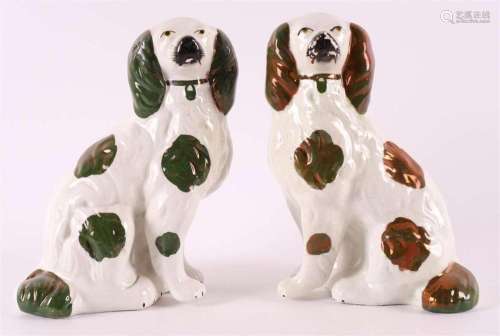 A pair of Staffordshire pottery dogs, England 19th century.