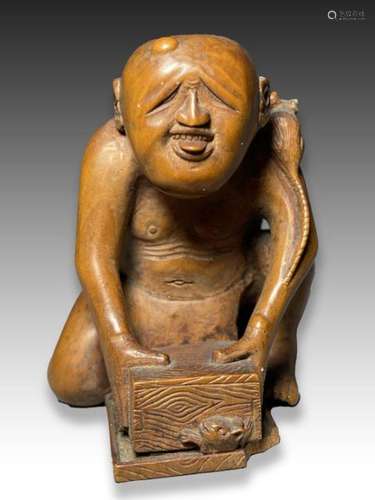 A WOOD NETSUKE DEPICTING A RAT CATCHER, MEIJI PERIOD