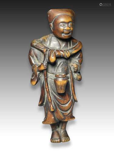 A WOOD NETSUKE OF A STREET VENDOR, MEIJI PERIOD