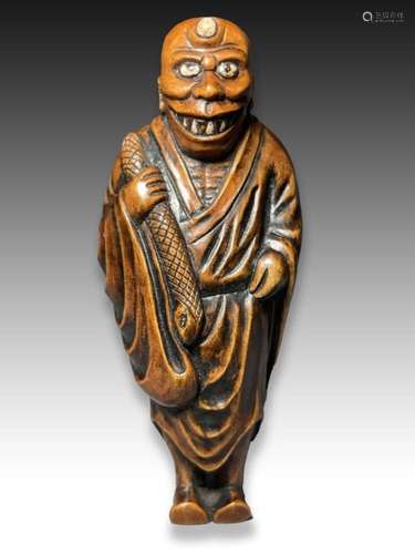 A WOOD NETSUKE OF A BAKEMONO, MEIJI PERIOD