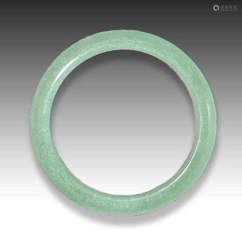 A PALE JADE CELADON BANGLE, QING DYNASTY (1644-1911)