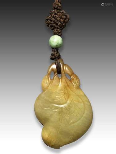 A CHINESE RUSSET YELLOW JADE CARVED PENDANT, QING DYNASTY (1...