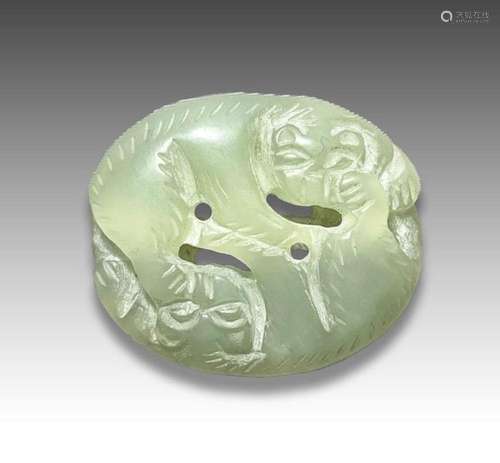 A JADE PENDANT OF TWO MYTHICAL BEASTS FIGHTING, QING DYNASTY...