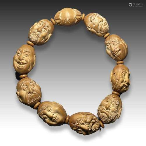 CHINESE CARVED NUT'S BUDDHA BRACELET, QING DYNASTY (1644...