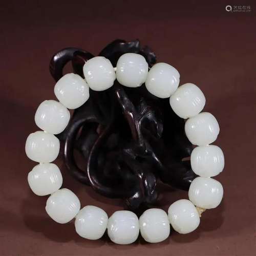 JADE CARVING OF BRACELET WITH LOTUS DESIGN