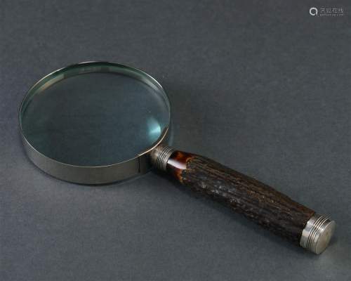 A Magnifyling Glass with Organic Handle
