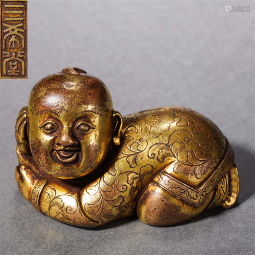A Chinese Bronze-gilt Kid Shaped Paper Weight Qing Dyn.