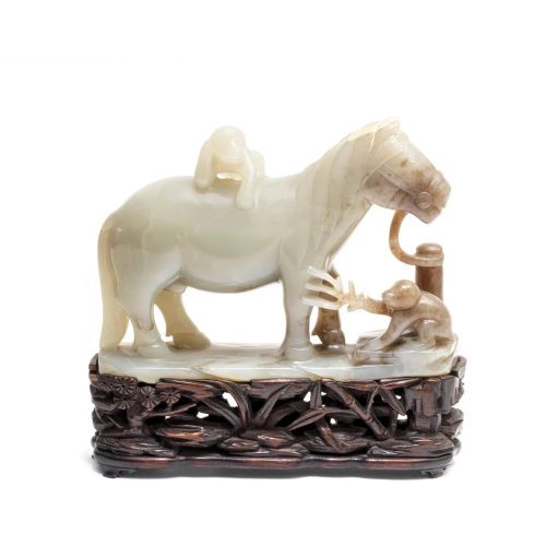 A PALE GREEN JADE 'HORSE AND MONKEYS' GROUP 18th c...