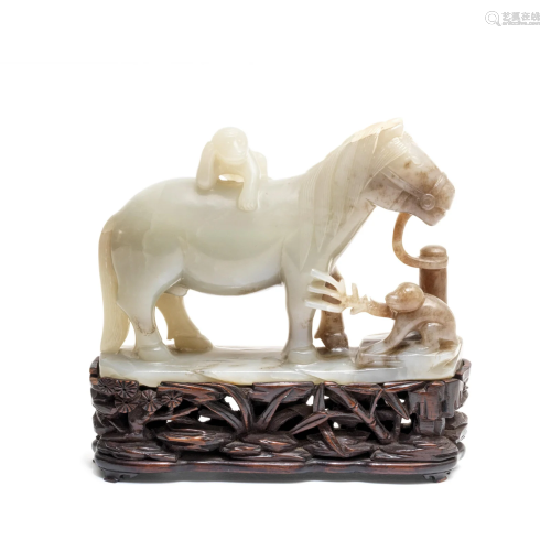 A PALE GREEN JADE 'HORSE AND MONKEYS' GROUP 18th c...