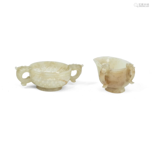 A PALE GREEN AND RUSSET JADE POURING VESSEL AND A TWO-HANDLE...