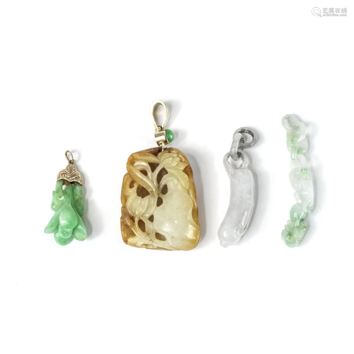 A RUSSET AND PALE GREEN JADE PENDANT AND THREE JADEITE ATTAC...