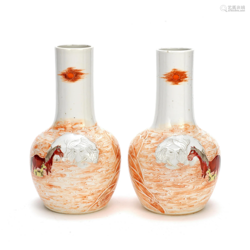 A PAIR OF MIRROR-IMAGE FAMILLE ROSE BOTTLE VASES Jiajing six...