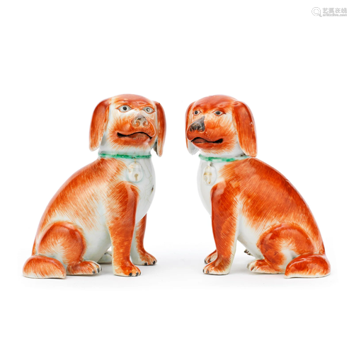 A PAIR OF IRON RED-ENAMELLED MODELS OF SEATED SPANIELS Qianl...