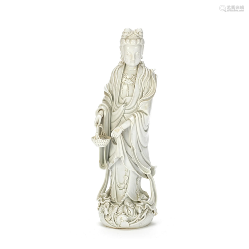 A BLANC-DE-CHINE FIGURE OF GUANYIN 19th century, two seal ma...