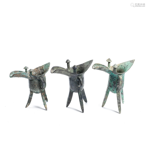 THREE ARCHAIC BRONZE RITUAL WINE VESSELS, JUE Shang Dynasty/...