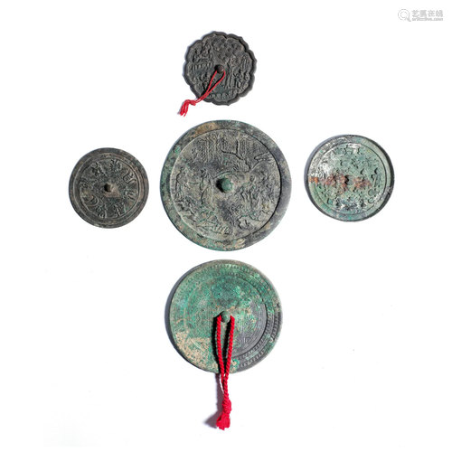 A GROUP OF FIVE VARIOUS BRONZE MIRRORS Han to Ming Dynasty (...