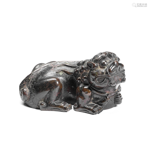 A BRONZE 'BUDDHIST LION' SCROLL WEIGHT 17th centur...