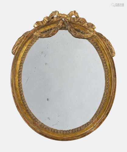 Petit miroir ovale de style Louis XVI, début XIXe s Bois scu...