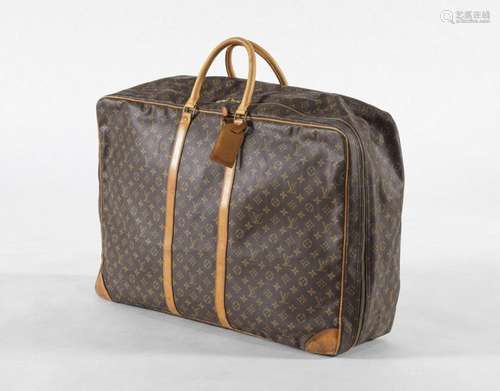 Louis Vuitton, valise souple Sirius 70 Toile Monogram et cui...