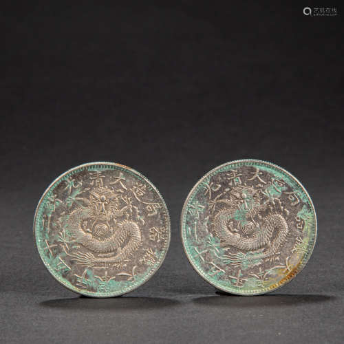 A PAIR OF CHINESE SILVER COINS