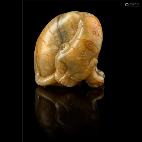 CELADON JADE WITH RUSSET SKIN CARVING OF A TIGER MING DYNAST...