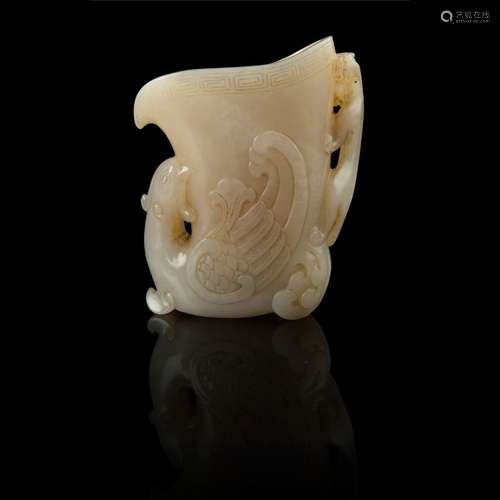 WHITE JADE 'PHOENIX AND CHI DRAGON' LIBATION CUP QING DYNAST...