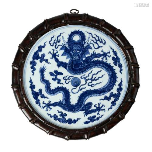 BLUE AND WHITE 'DRAGON' CIRCULAR PLAQUE QING DYNASTY, 18TH C...