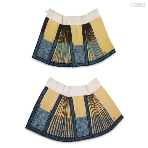 TWO HAN CHINESE WOMAN'S EMBROIDERED YELLOW SILK PLEATED SKIR...