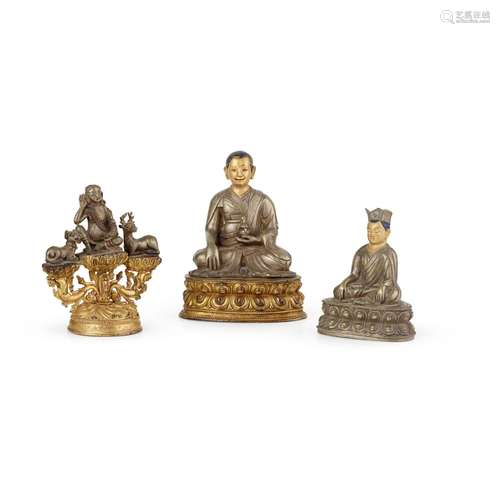 GROUP OF THREE SILVER AND GILT COPPER ALLOY FIGURES OF BUDDH...