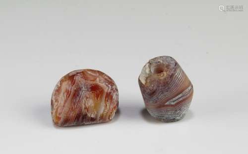 A Group of Two Tibetan 'First-Line' Dzi Beads