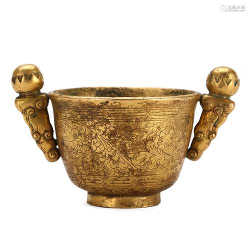 A GILT-BRONZE CUP WITH HANDLES