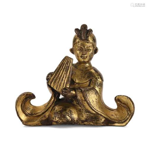 A GILT-BRONZE SEATED BOY ATTENDANT