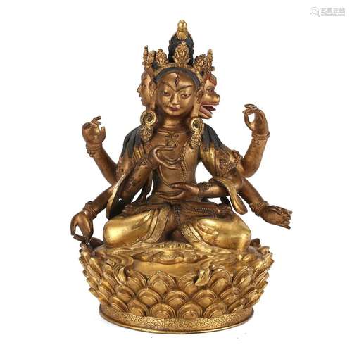 A GILT-BRONZE FIGURE OF FOUR-ARMED BODHISATTVA