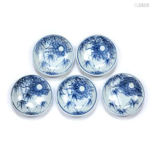 Set of five Kutani blue and white saucer form dishes