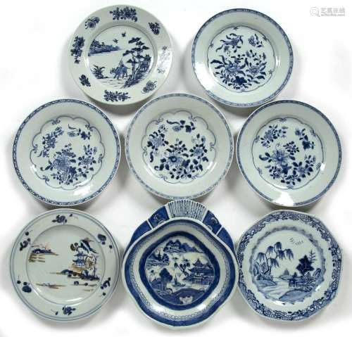 Group of seven blue and white plates