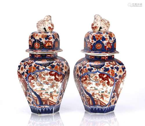 Pair of Imari hexagonal vases and covers