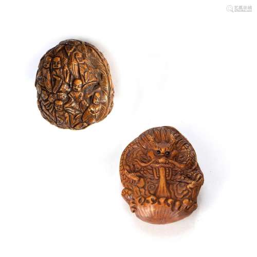 Two carved nut pendants