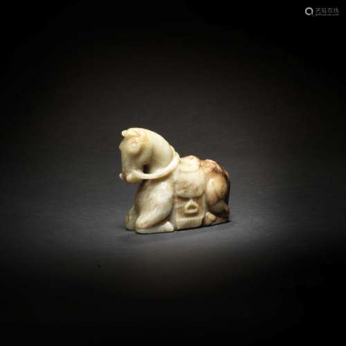 A PALE GREEN AND RUSSET JADE CARVING OF A HORSE Ming Dynasty...