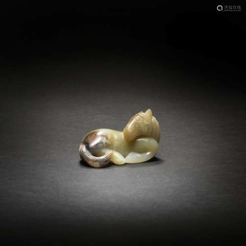 A PALE GREEN AND RUSSET JADE CARVING OF A HORSE 17th/18th ce...