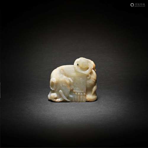 A PALE GREEN AND RUSSET JADE 'ELEPHANT AND BOY' GROUP 17th/1...