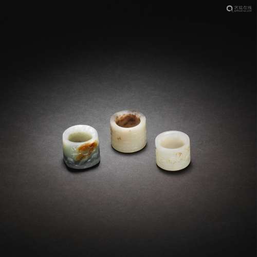 THREE JADE THUMB RINGS 18th/19th century (3)