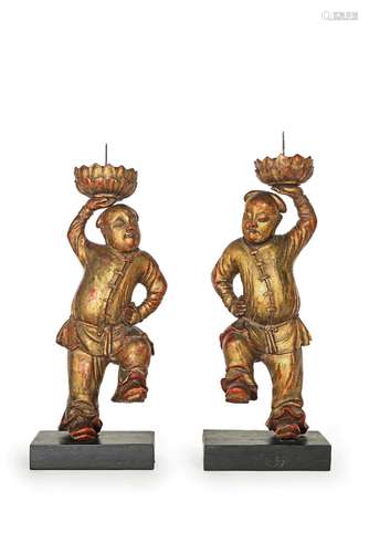 A PAIR OF GILT-LACQUERED 'LEAPING BOYS' CANDLESTICKS  18th/e...